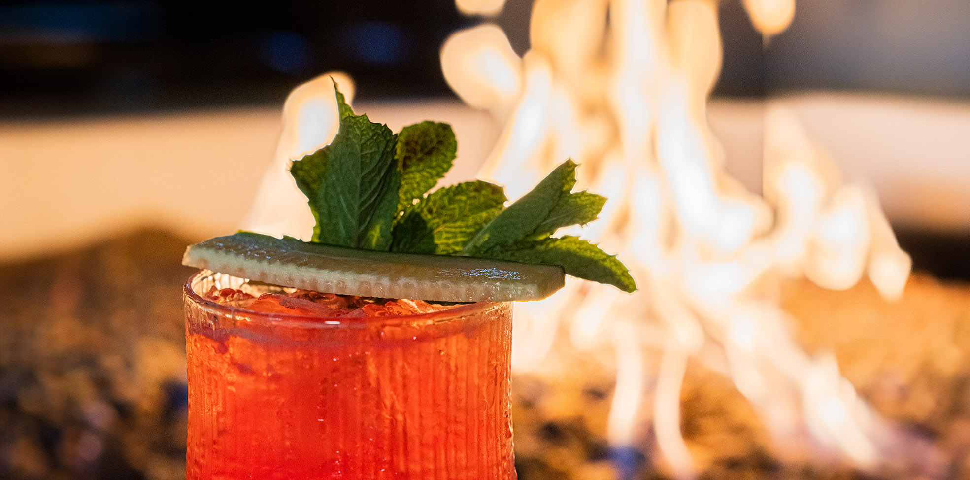 cocktail overlooking bonfire